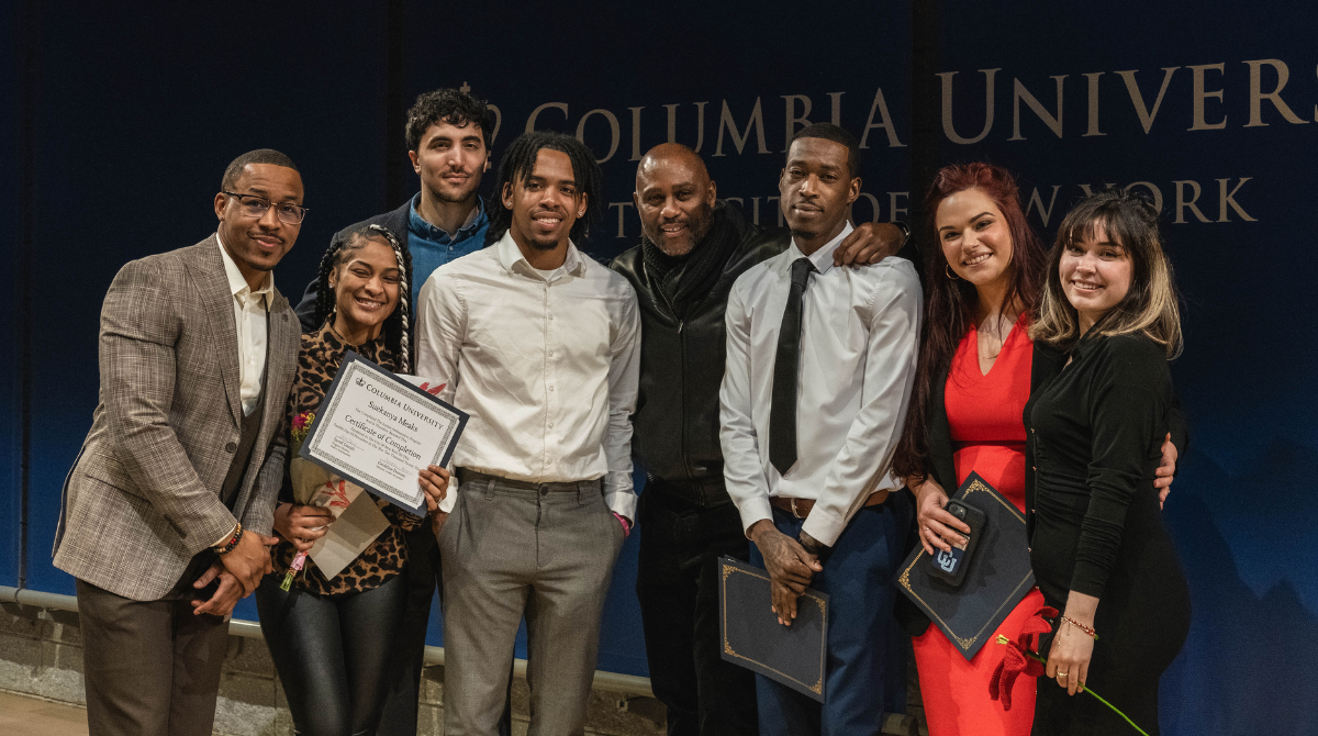 Group picture of JAYC graduates holding their certificates and Center for Justice staff at the Forum
