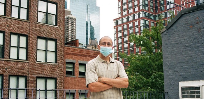 Photo of Tomas Correra in front of buildings in NYC